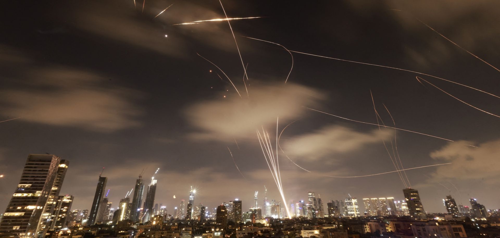 Israeli air defense systems are activated to intercept Iranian missiles over the Israeli city of Tel Aviv early on June 18, 2025.