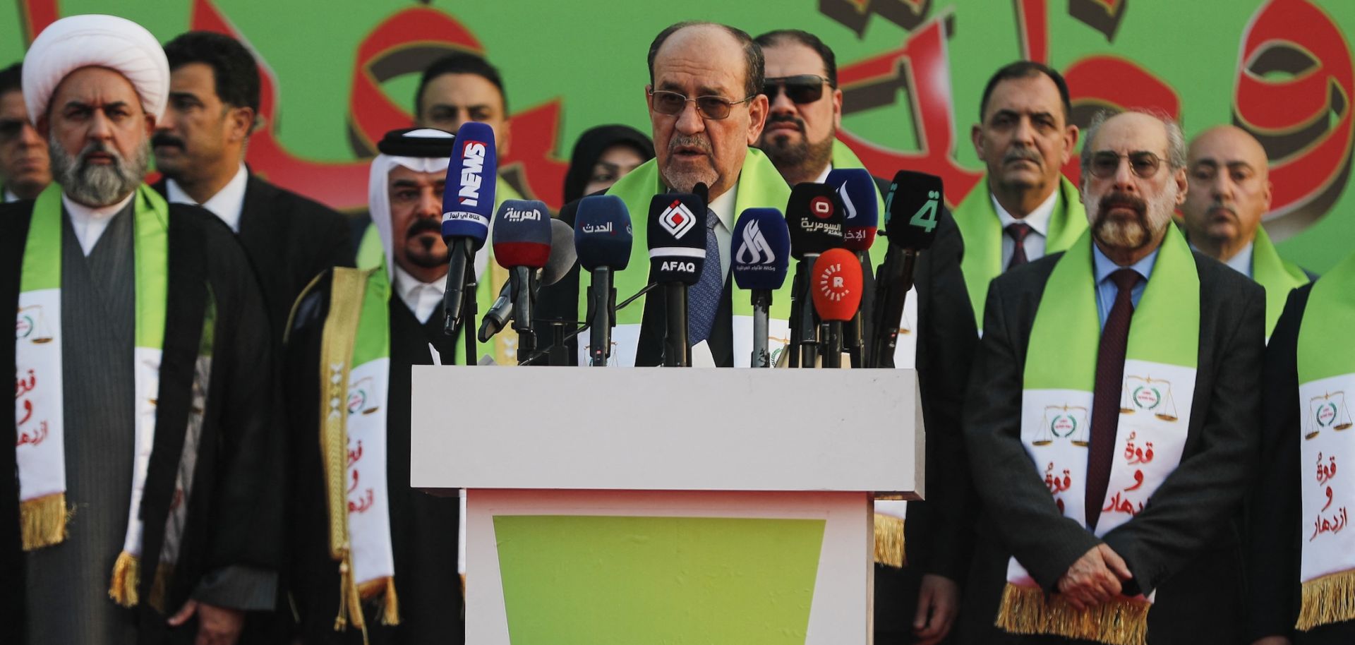 Former Iraqi Prime Minister Nouri al-Maliki (center) delivers a speech during a campaign rally in Baghdad ahead of parliamentary elections on Nov. 7, 2025. 