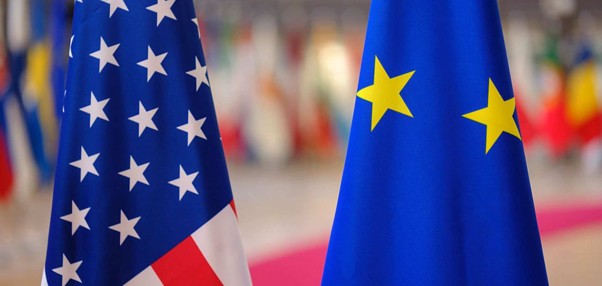 The U.S. and the EU flags are seen side by side on Nov. 21, 2025, in Brussels, Belgium. 