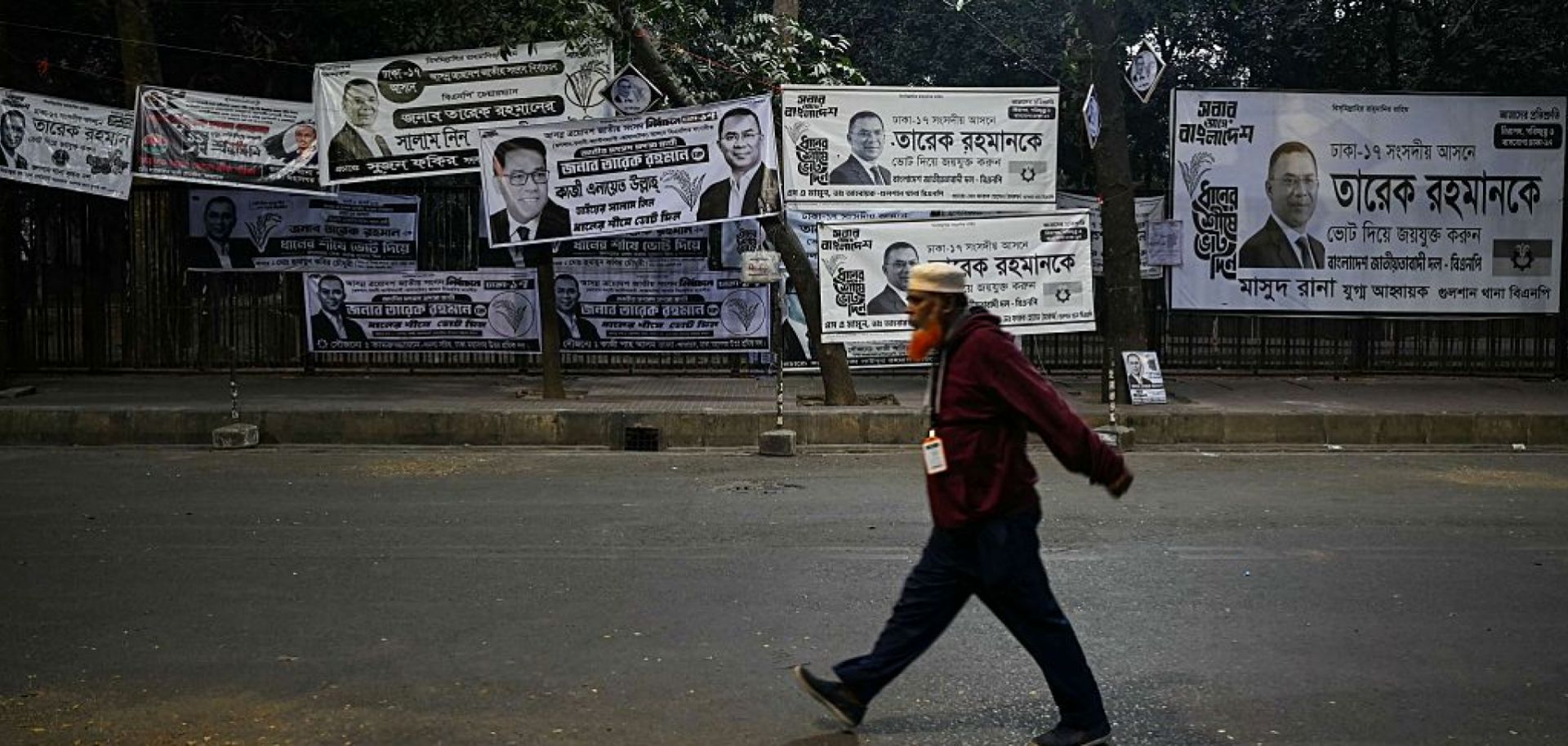 A man walks past campaign posters of Bangladesh Nationalist Party (BNP) chairman and Tarique Rahman in Dhaka on Feb. 13, 2026.
