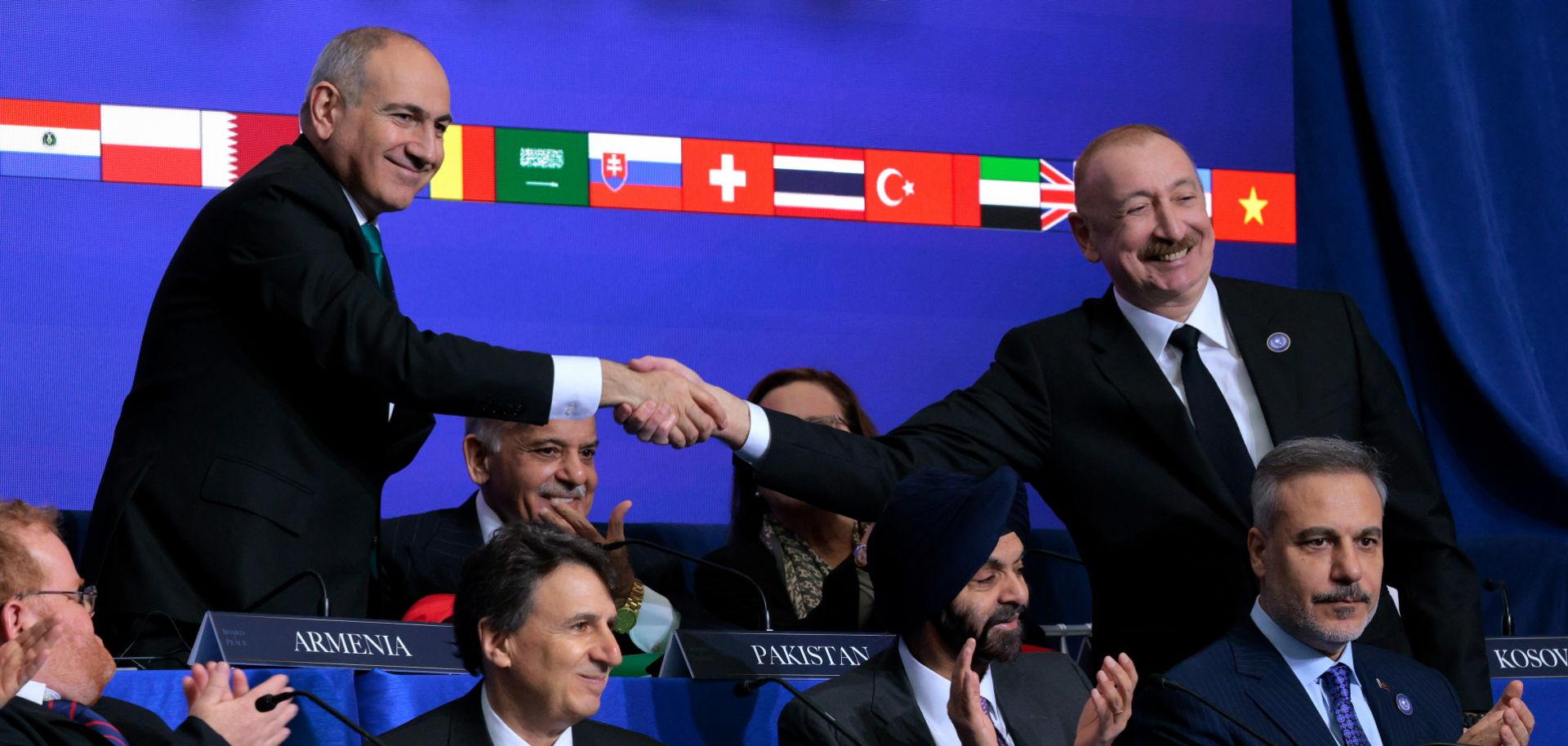 Armenian Prime Minister Nikol Pashinyan (left) shakes hands with Azerbaijani President Ilham Aliyev during the inaugural meeting of the Board of Peace at the Donald J. Trump Institute of Peace on Feb. 19, 2026, in Washington, D.C.