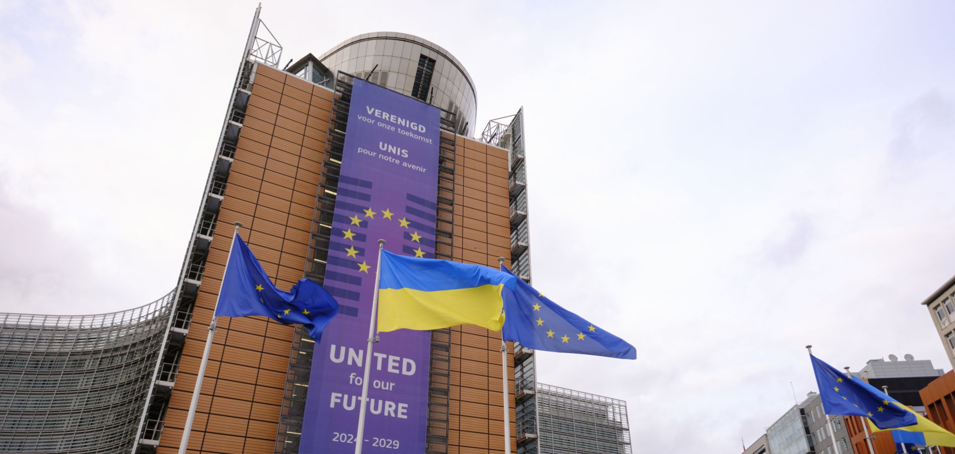 EU and Ukrainian flags fly outside the European Commission headquarters on Feb. 23, 2025, in Brussels, Belgium.