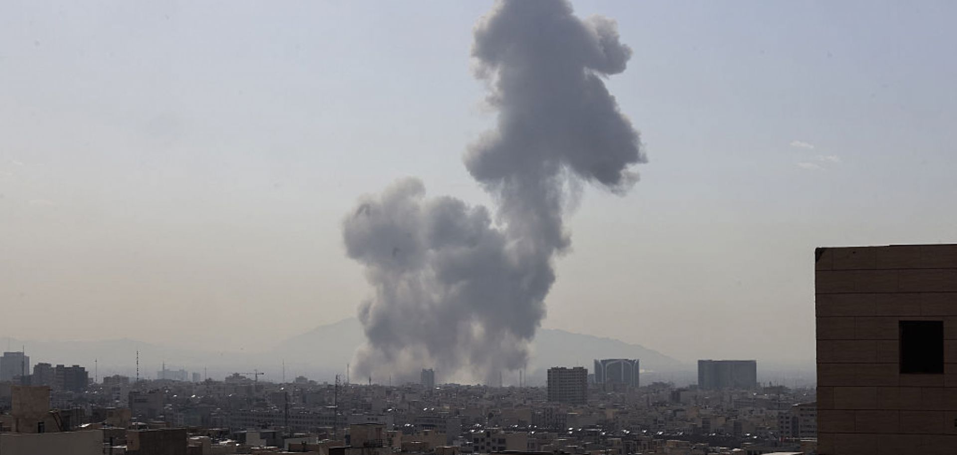 A plume of smoke rises following a reported explosion Feb. 28 in Tehran.