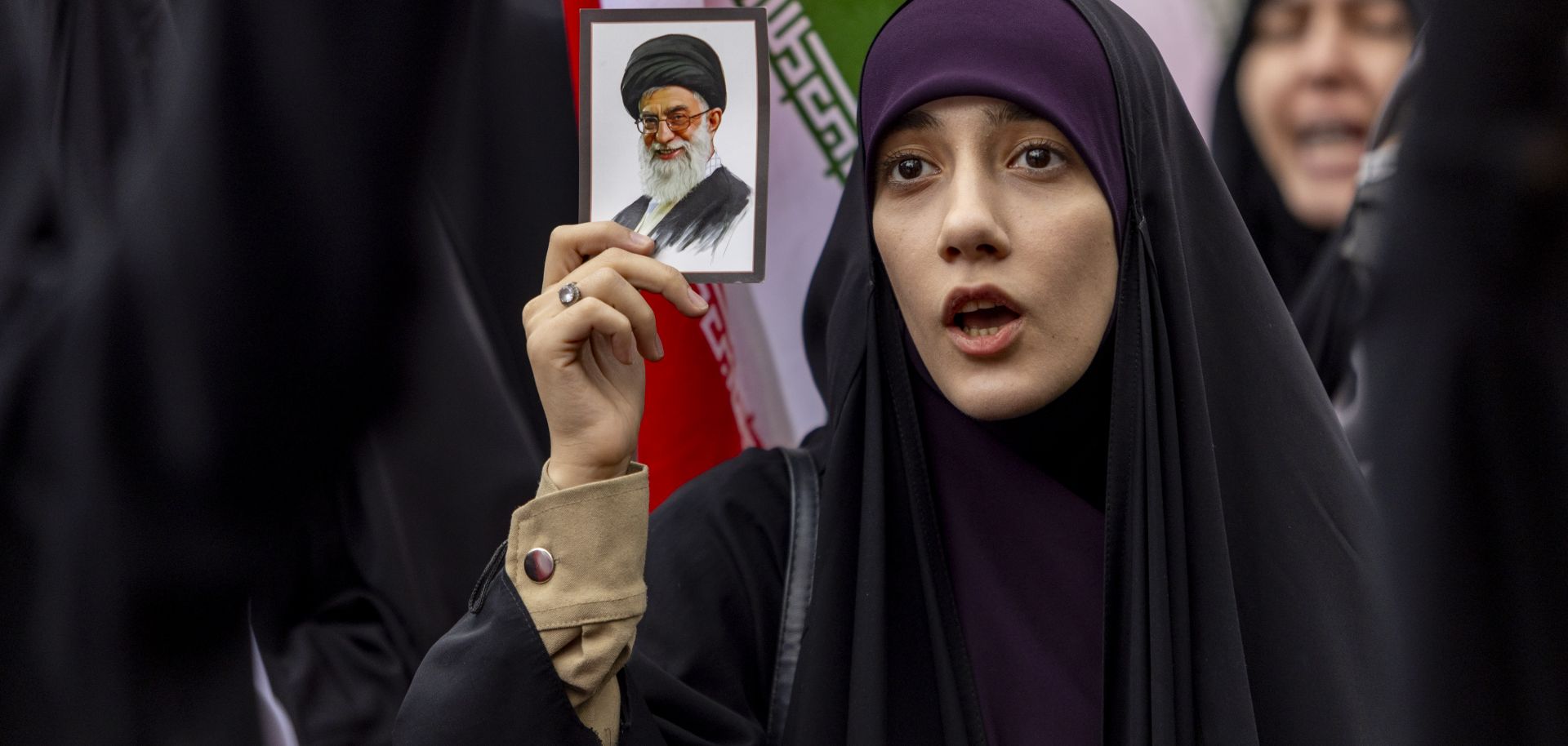 A woman holds a photo of Ayatollah Ali Khamenei as Iranians protest against attacks on Iran by Israel and the United States on Feb. 28, 2026 in Tehran, Iran. 