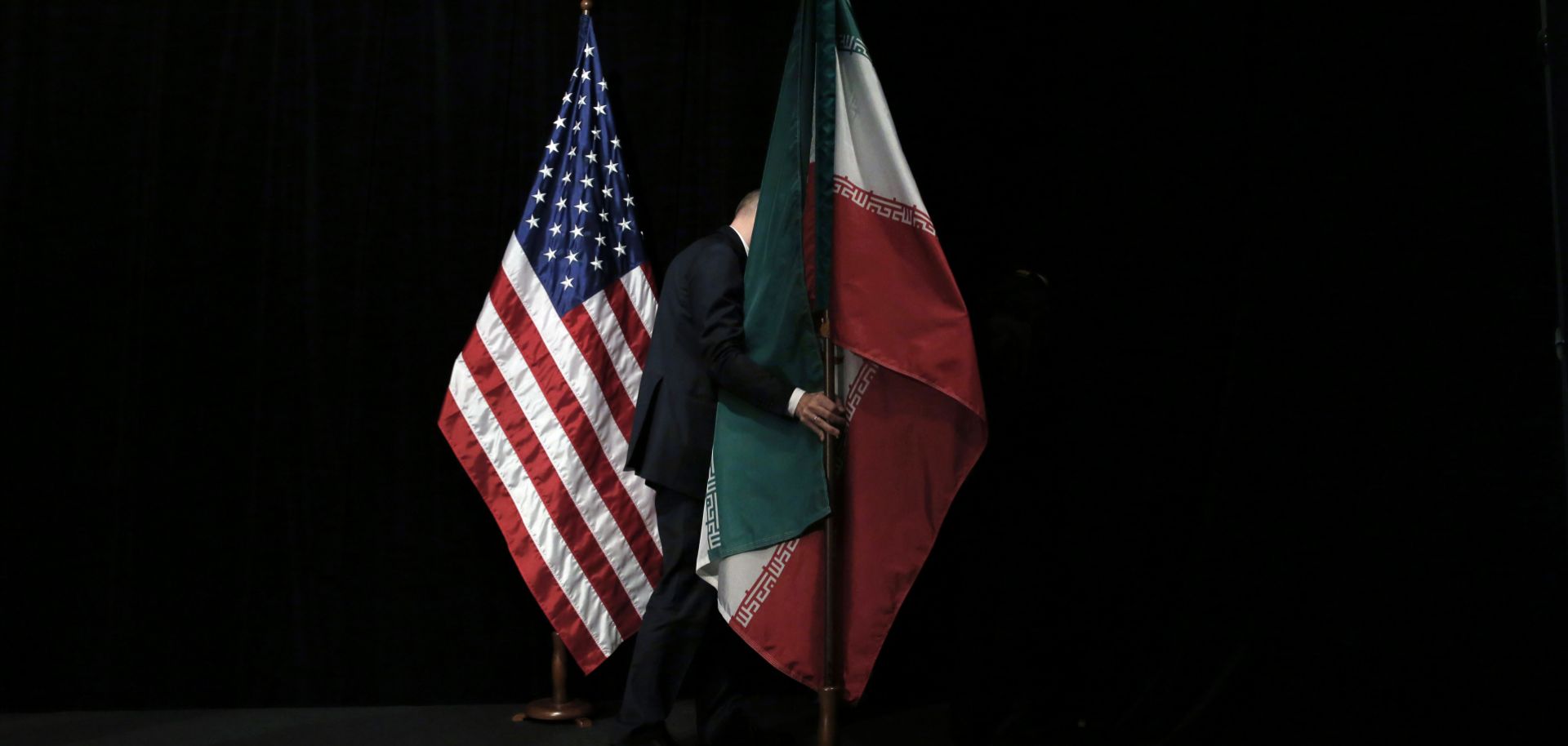 The U.S. and Iranian flags are seen on a stage during nuclear talks in Vienna, Austria. 