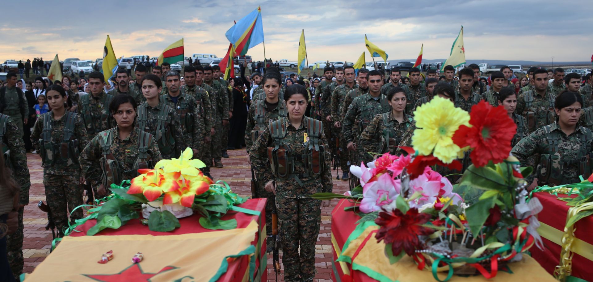 Members of the Women's Protection Units (YPJ) take part in the funeral of eight fighters on Nov. 8, 2015, in Derik, Syria. 