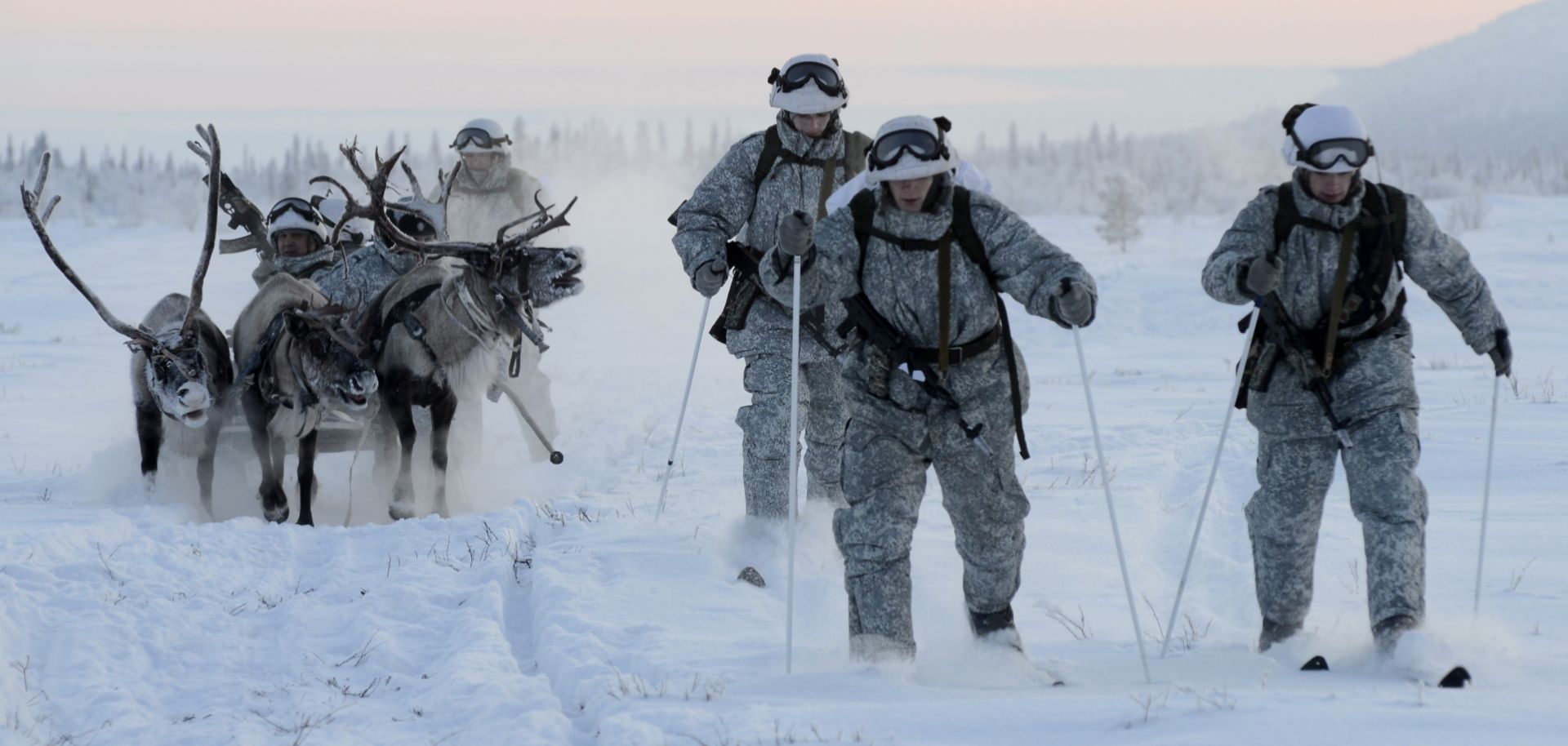 Reconnaissance unit members of the Russian Northern Fleet's Arctic mechanized infantry brigade conduct military exercises to learn how to ride a reindeer sled at a reindeer farm near the Lovozero settlement. 