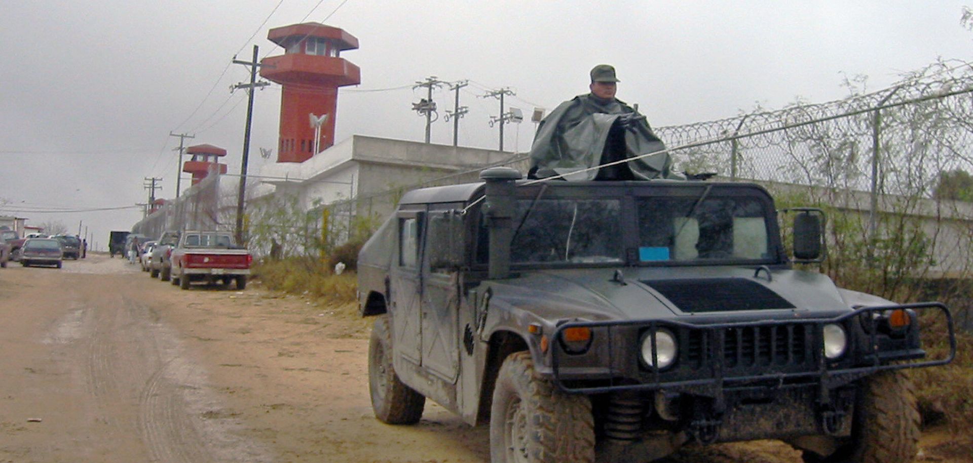 More than 100 Mexican military and police forces guard a prison in Nuevo Laredo during a security task to conduct a search operation inside the institution for arms, drug and other unauthorized items on Jan. 31, 2005.