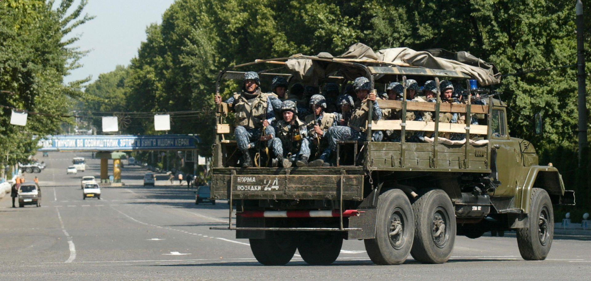 Uzbekistan's special forces soldiers sit in a military truck patrolling the streets of the Uzbek town of Andijan on May 17, 2005. 