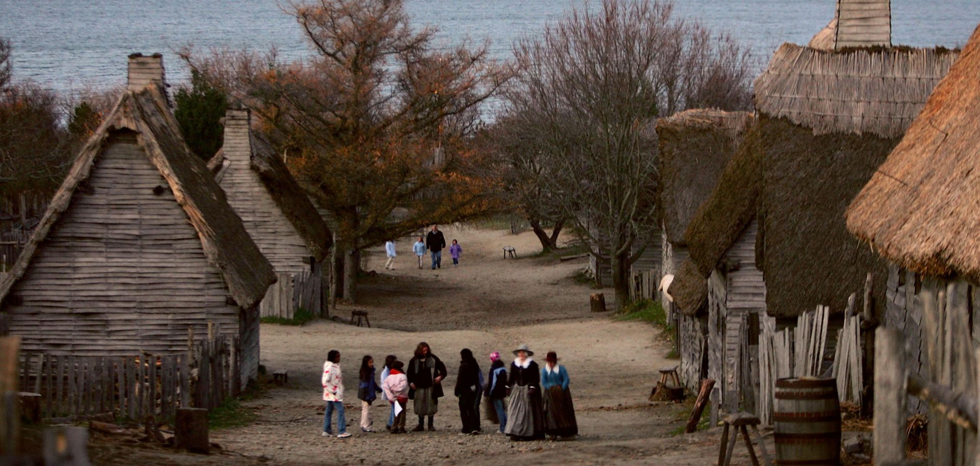 People visit the 1627 Pilgrim Village at "Plimoth Plantation," where role-players portray pilgrims seven years after the arrival of the Mayflower, in Plymouth, Massachusetts.