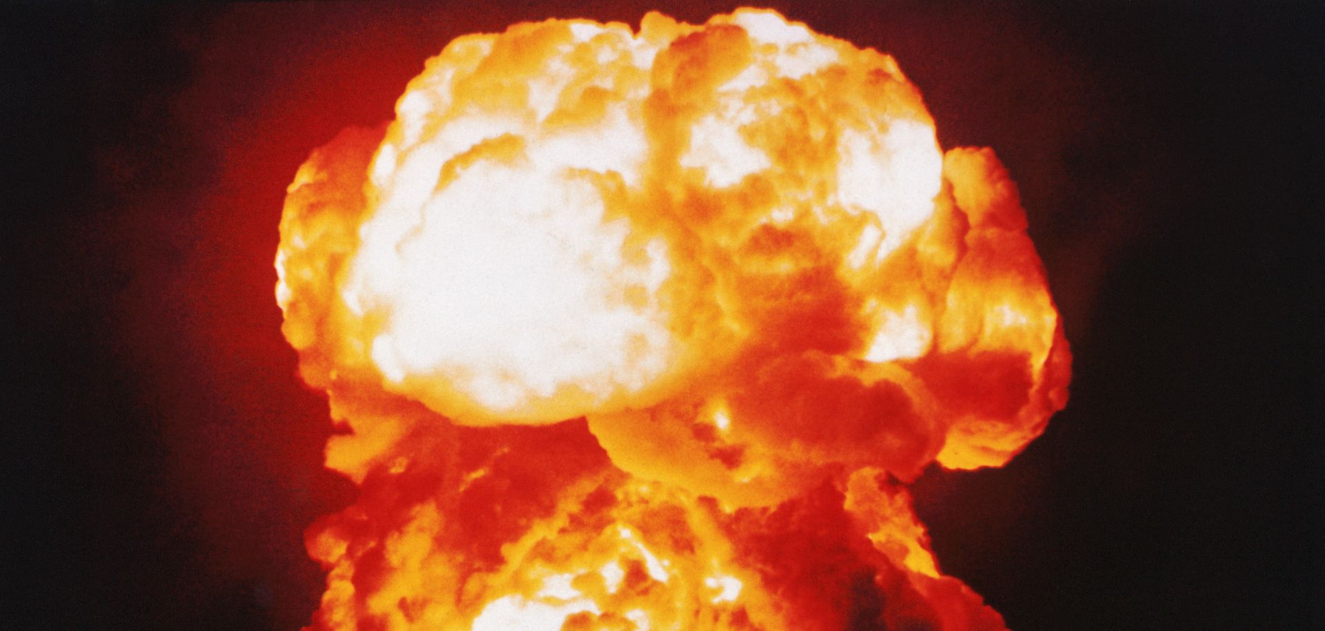 The United States detonates an atomic bomb nicknamed "Smokey" as part of Operation PLUMBBOB in the Nevada desert in 1957.