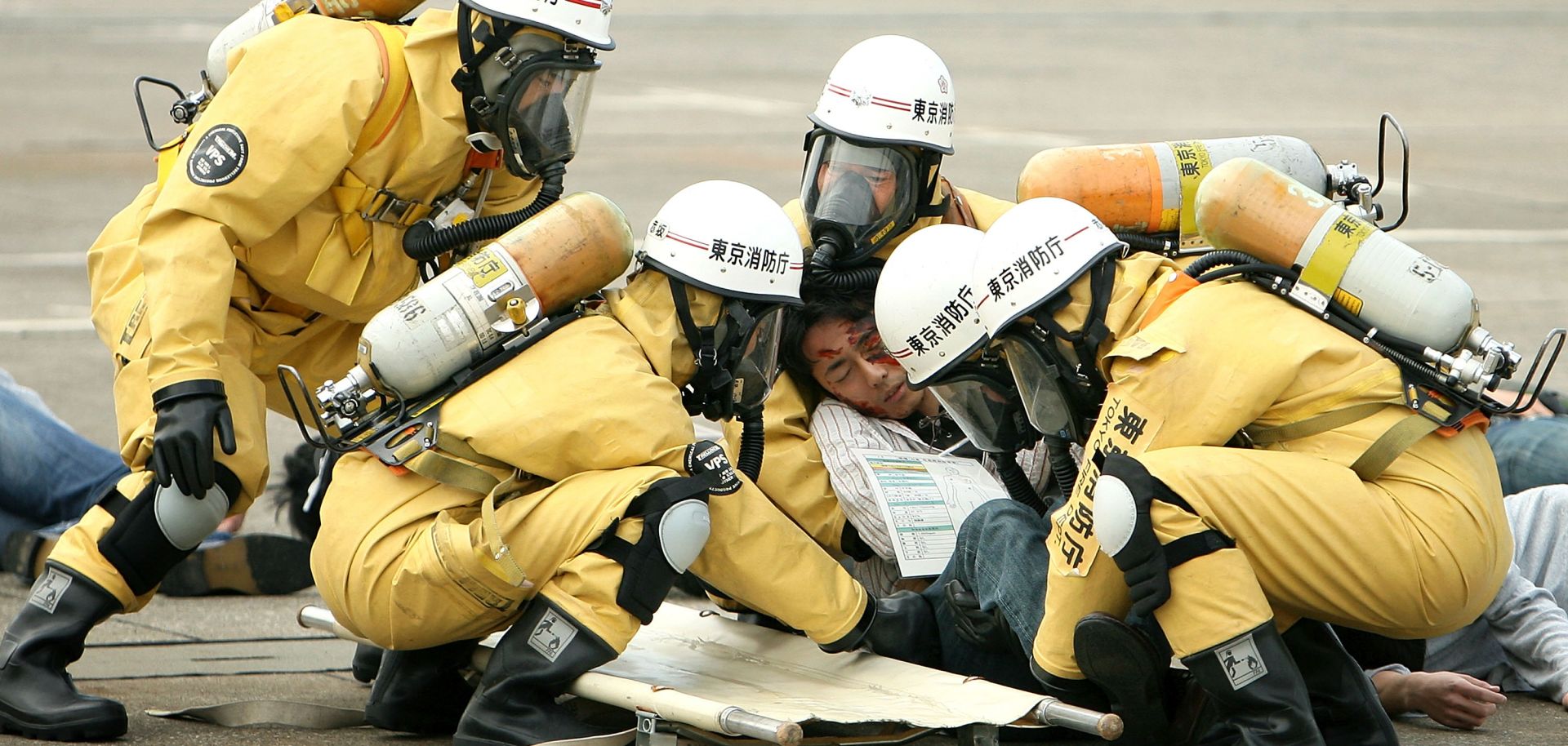 Members of the Tokyo Fire Department rescue a man in the role of the injured during an anti-terrorism exercise conducted by the Tokyo Metropolitan Government.