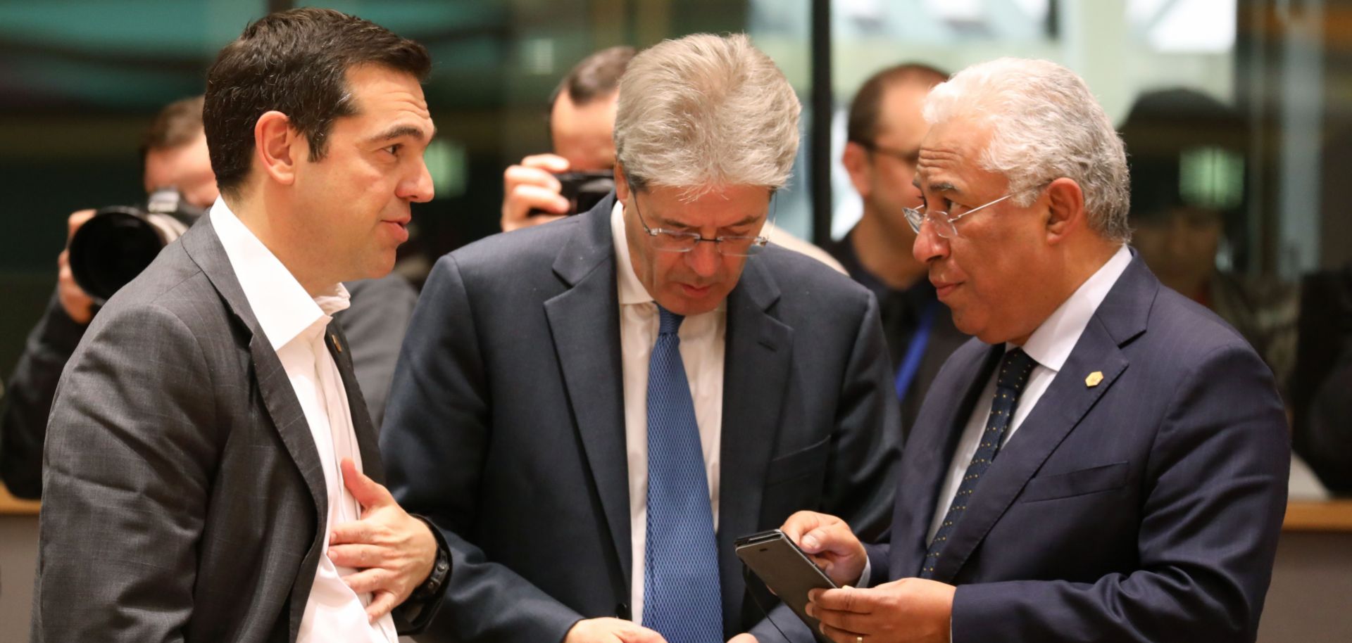 In this photo, Greece's Prime Minister Alexis Tsipras speaks with Italy's Prime Minister Paolo Gentiloni and Portugal's Prime Minister Antonio Costa during a summit of European Union leaders in Brussels during March 2018.