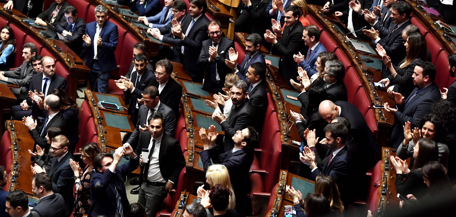 Members of the Five Star Movement political party applaud the election of one of their own, Roberto Fico, not pictured, as speaker of Italy's Chamber of Deputies in Rome on March 24, 2018.