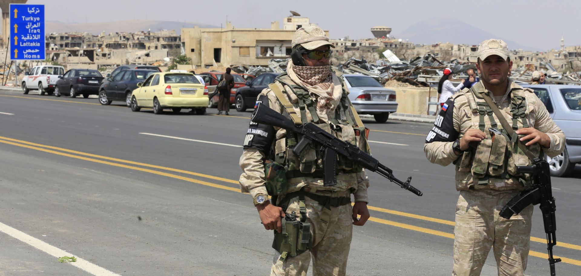 In this photograph, Russian military police guard a road outside Damascus, Syria, after it reopened May 15, 2018.