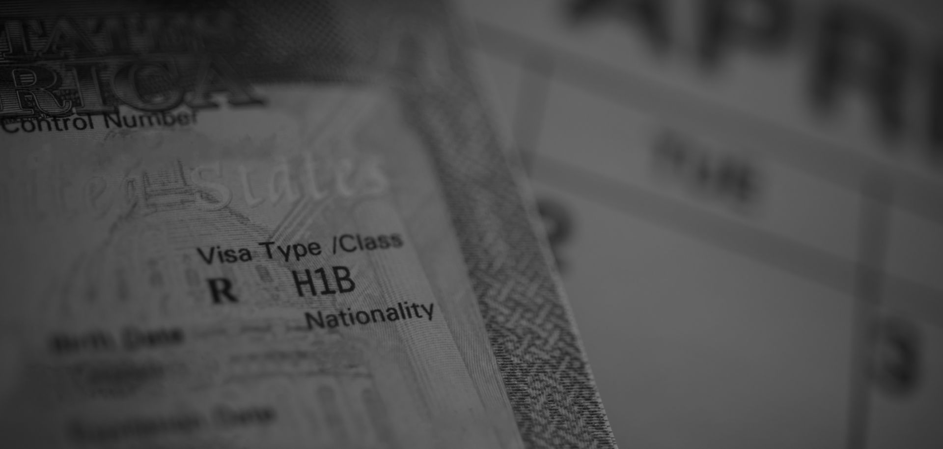 An H1B visa (for specialty workers) stamp is seen in a passport.