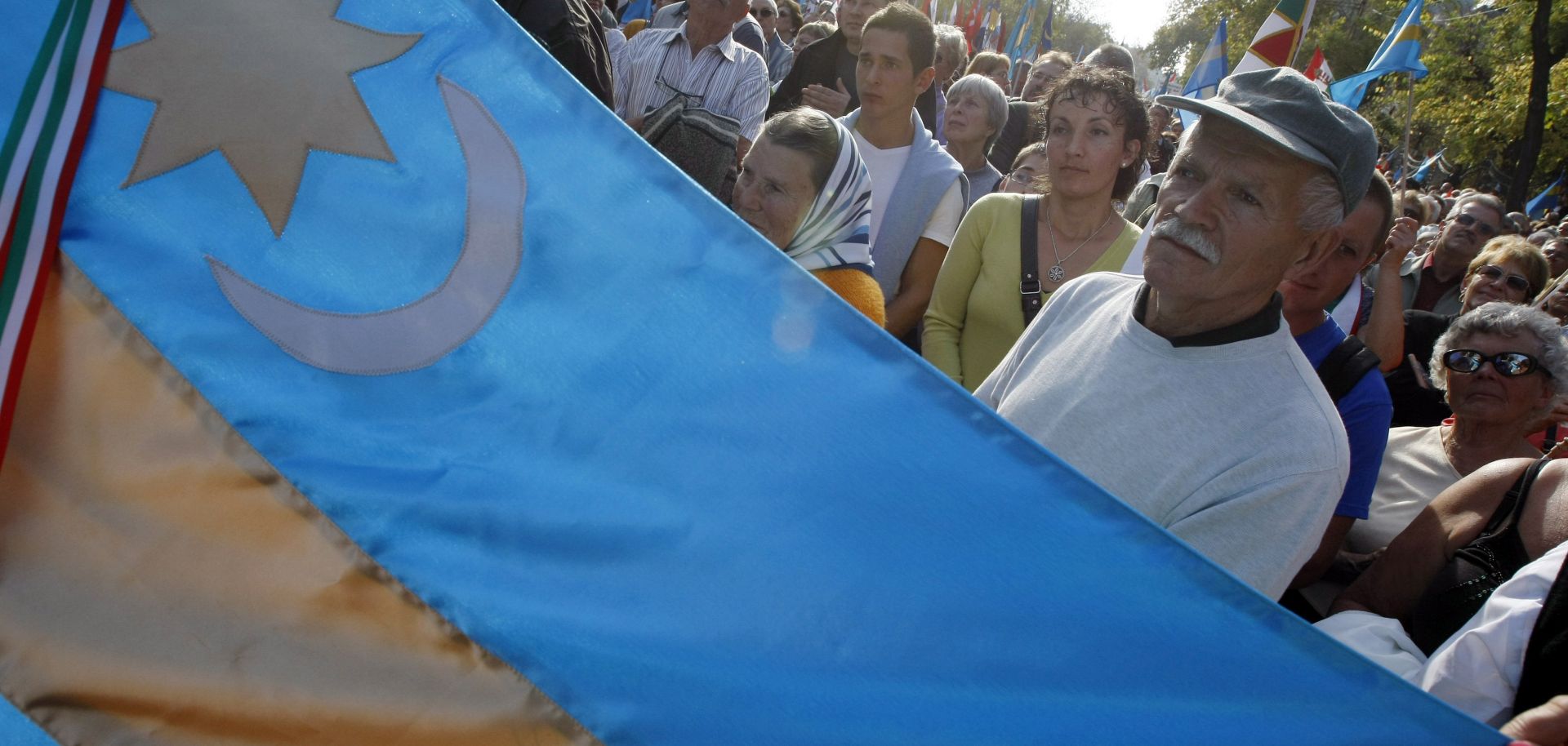 Hungarians hold Transylvanian flags as they take part in a demonstration for the autonomy of Transylvanian territory from Romania in Budapest, Hungary on October 27, 2013.