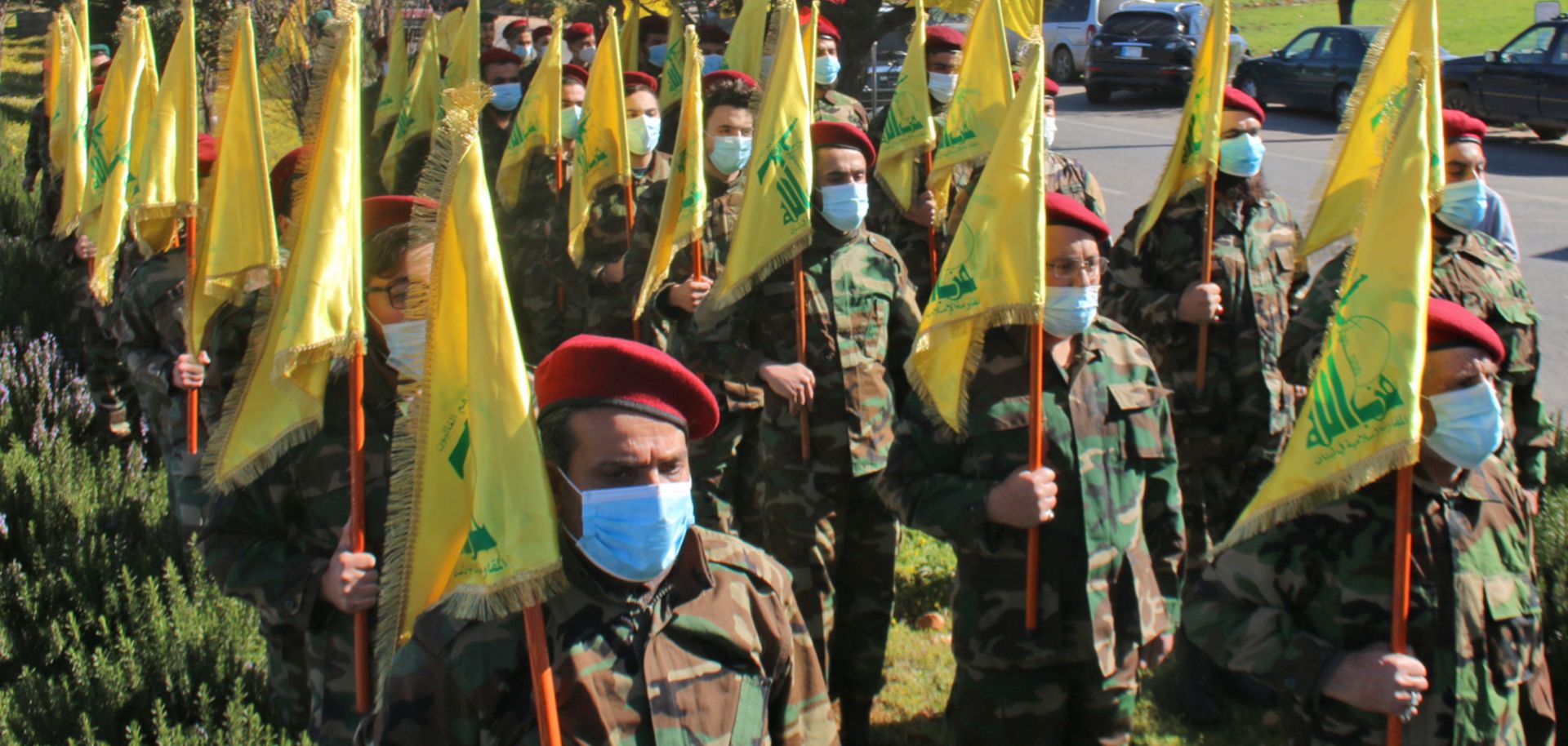 Hezbollah members hold a military parade in the Lebanese town of Riyaq on Feb. 13, 2021. 