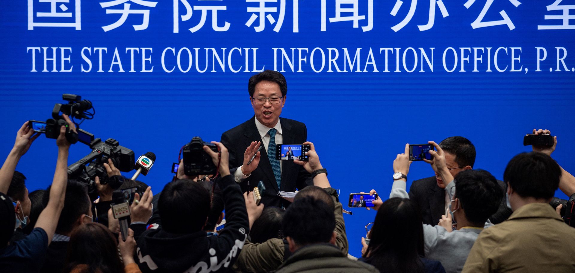 Zhang Xiaoming (C), Executive Deputy Director of the Hong Kong and Macao Affairs Office of the State Council, at the end of a State Council press conference on Hong Kong electoral reform March 12, 2021, in Beijing.