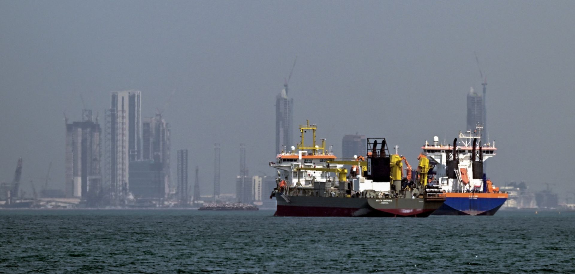 Commercial vessels are pictured offshore in Dubai on March 11, 2026. 