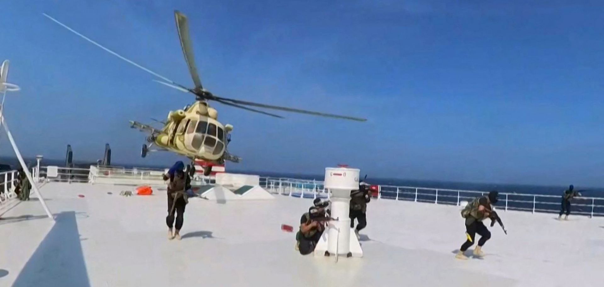 A grab from handout footage released by Yemen's Huthi Ansarullah Media Center on Nov. 19, 2023, reportedly shows members of the rebel group during the capture of an Israel-linked cargo vessel at an undefined location in the Red Sea. 