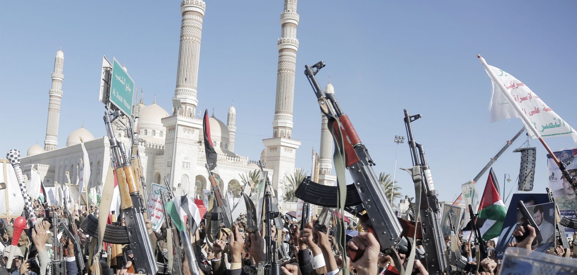 Supporters of Yemen's Houthi movement brandish weapons and chant slogans as they take part in a protest staged in solidarity with the Palestinian people in Gaza on Jan. 17, 2025, in Sanaa, Yemen. 