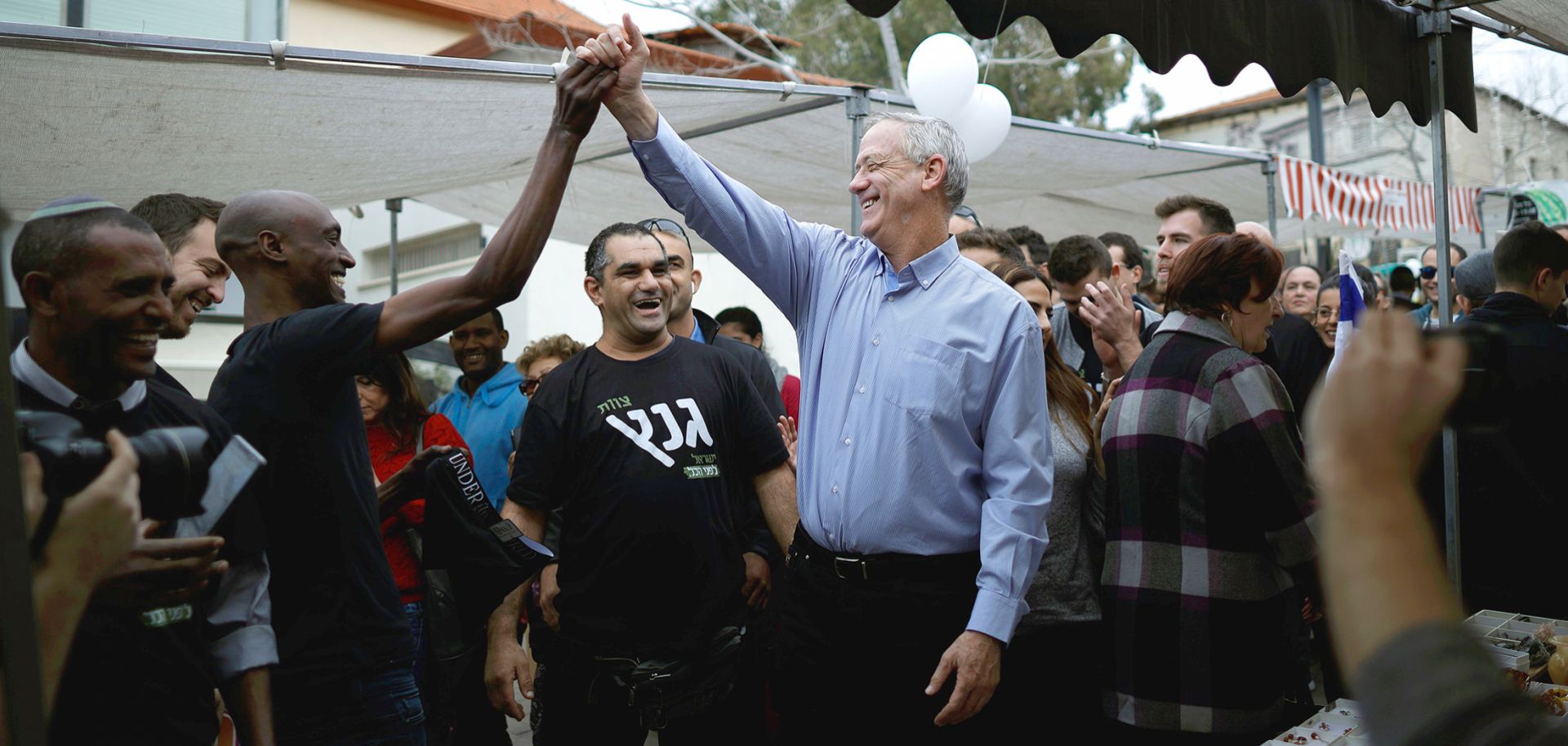 Retired Israeli general Benny Gantz mingles with people during an electoral campaign tour south of Tel Aviv in February 2019. 
