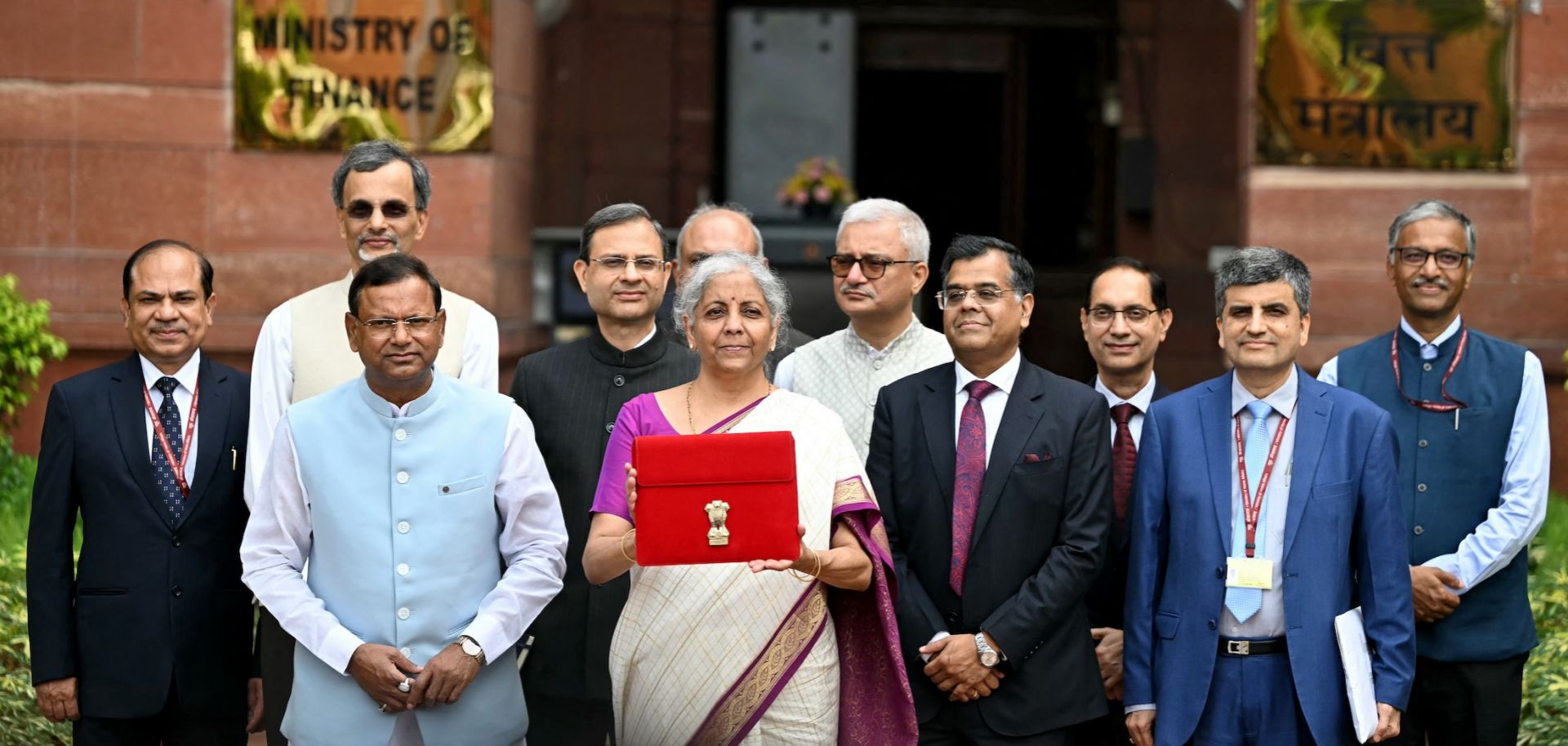 Indian Finance Minister Nirmala Sitharaman (fifth from left) poses for photos in New Delhi before presenting India's budget to parliament on July 23, 2024. 