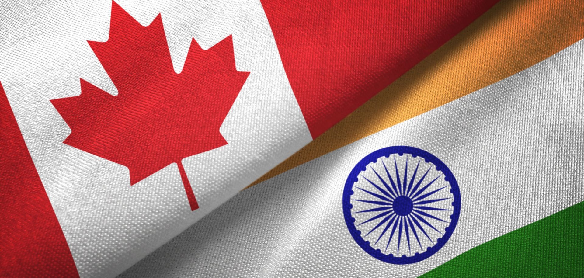 A digital illustration of the Indian and Canadian flags.