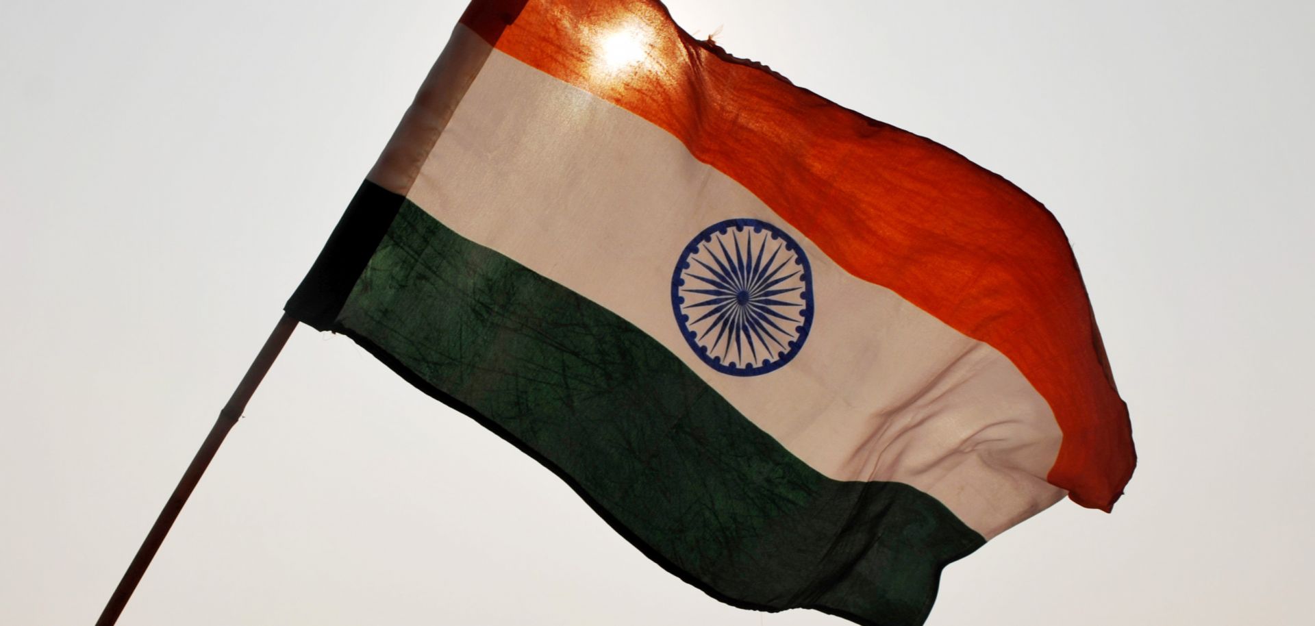 India’s national flag waves above a rally in New Delhi. 