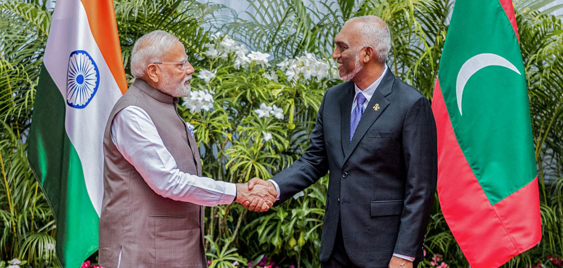 Indian Prime Minister Narendra Modi (left) shakes hands with Maldivian President Mohamed Muizzu upon meeting in Male on July 25, 2025. 