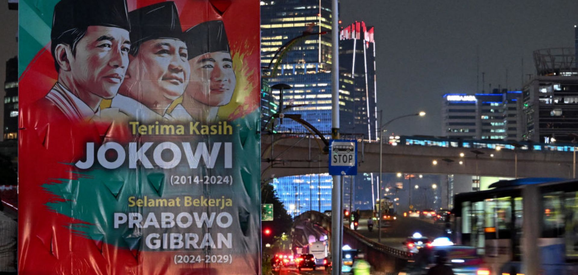 Vehicles pass by a banner thanking outgoing Indonesian President Joko "Jokowi" Widodo and congratulating President-elect Prabowo Subianto and Vice President-elect Gibran Rakabuming Raka ahead of their Oct. 20 inauguration in Jakarta, Indonesia, on Oct. 17, 2024.