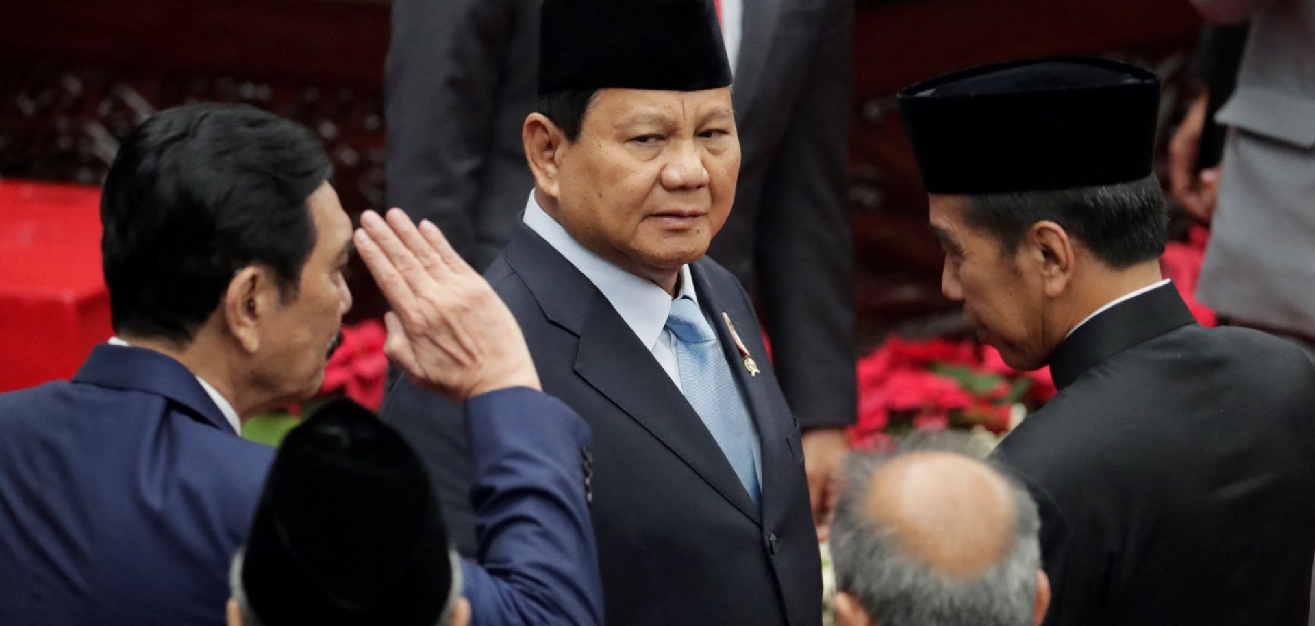 Indonesian Defense Minister and President-elect Prabowo Subianto (center) is seen next to outgoing President Joko Widodo (right) in the parliament building in Jakarta on Aug. 16, 2024. 