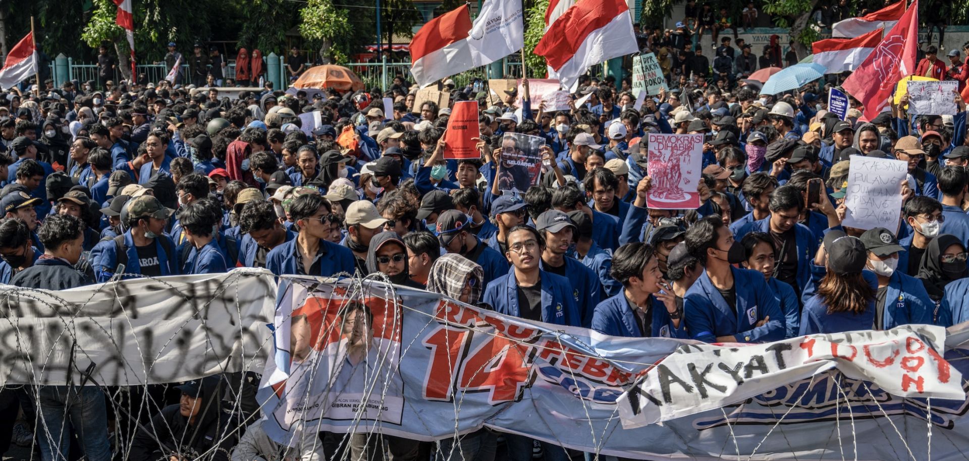 People gather in front of the East Java Provincial Parliament in Surabaya, Indonesia, on Aug. 23, 2024, as they protest against a move to overturn a Constitutional Court decision on election rules. 