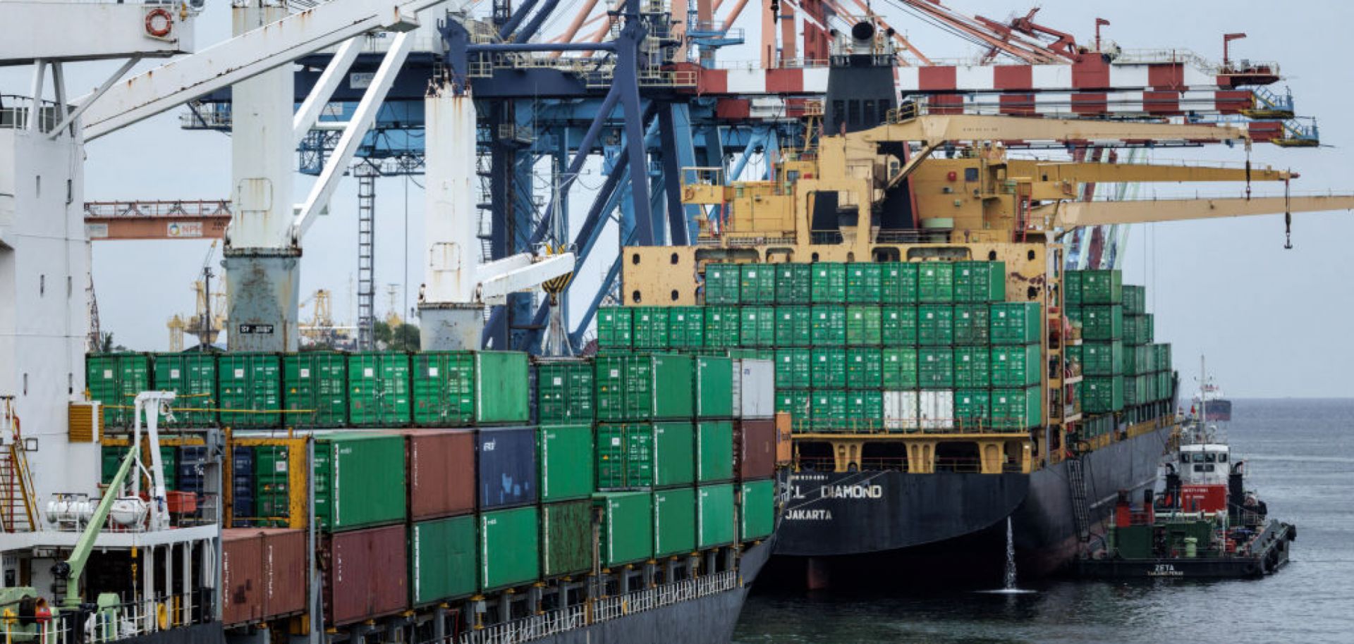 Containers are unloaded from a ship at a terminal of Tanjung Priok Port, the main seaport in Jakarta, Indonesia, on Jan. 24, 2025. 