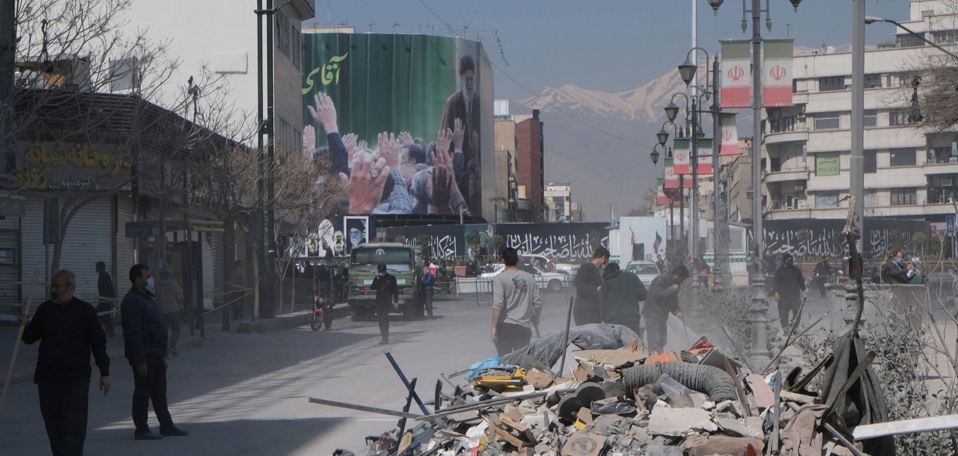 Volunteers clean up the rubble outside a government building in Tehran, Iran, that was destroyed by U.S. and Israeli strikes on March 4, 2026.