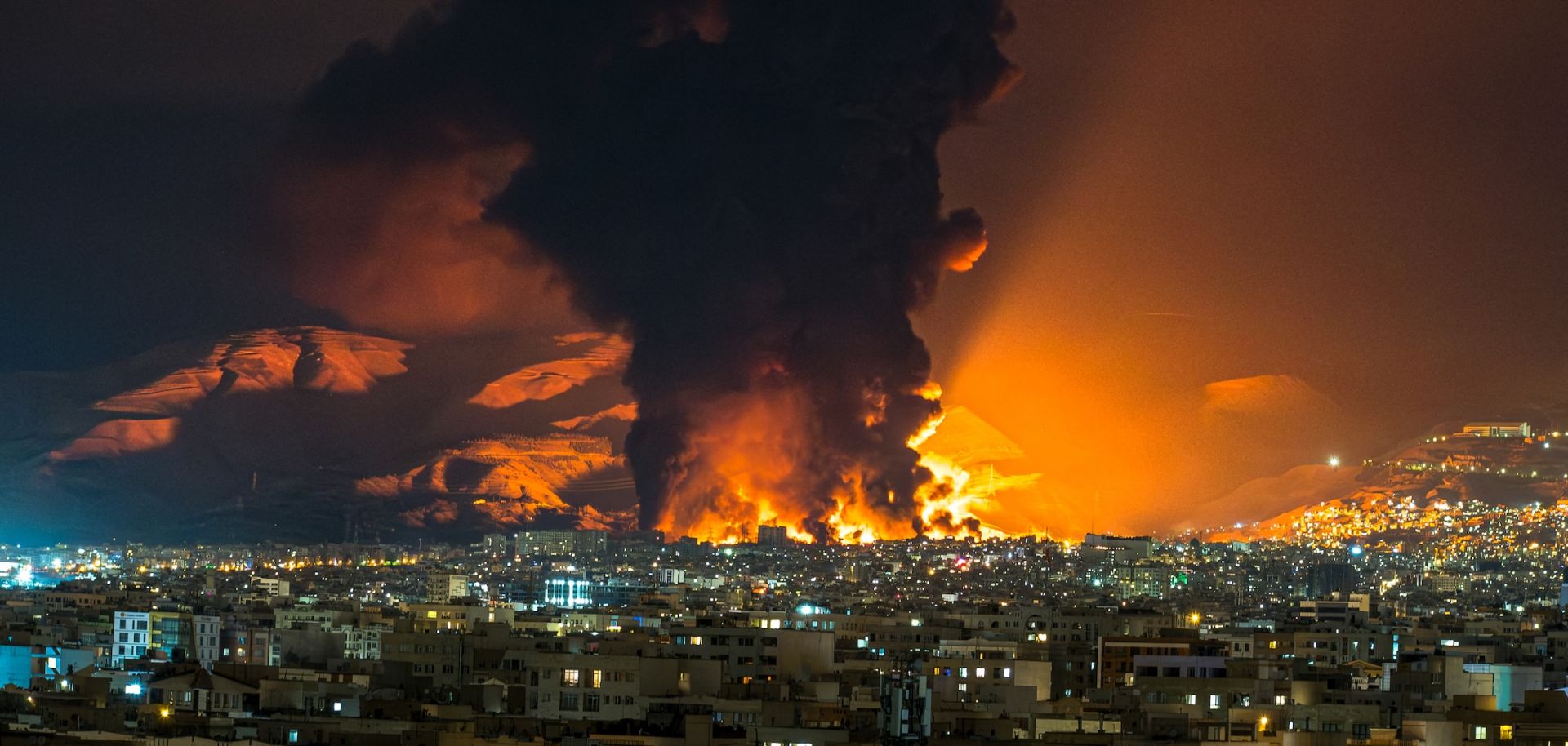 Smoke and flames rise at the site of airstrikes on an oil depot in Tehran, Iran, on March 7, 2026.