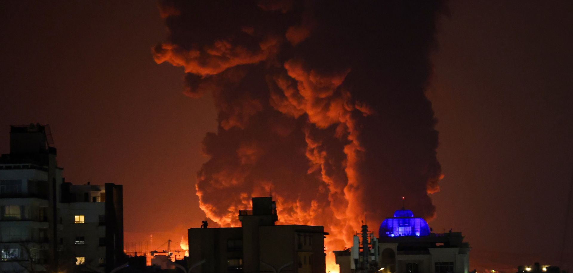 A large plume of smoke rises March 7 over Tehran after explosions were reported in the Iranian capital during the night.