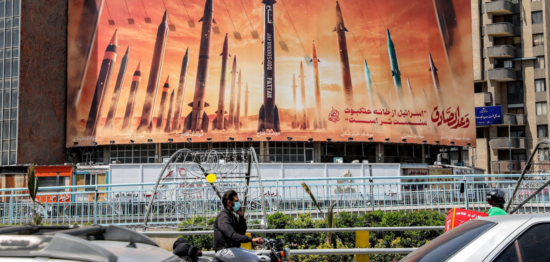 A banner depicts IRGC missile models aimed at Israel on April 16 in the Iranian capital of Tehran.