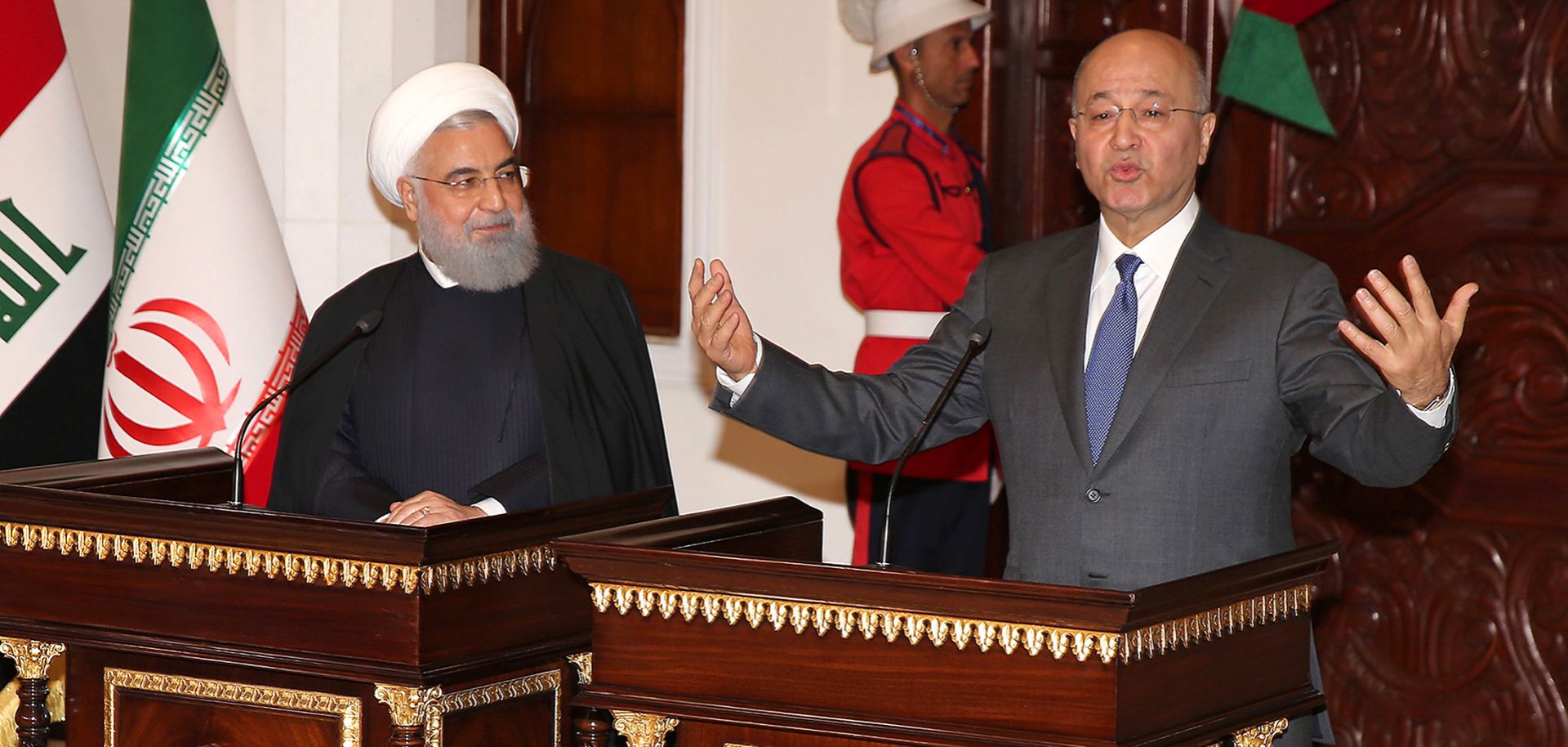 Iraqi President Barham Salih, right, holds a joint press conference with his Iranian counterpart Hassan Rouhani at the presidential palace in Baghdad on March 11, 2019.