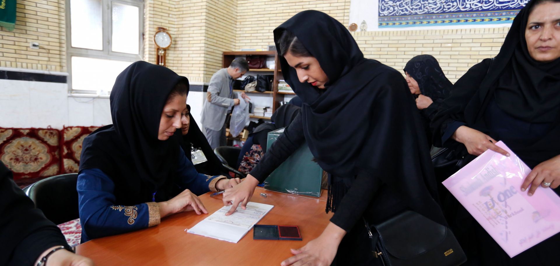 This photo shows a woman voting in Iran's 2016 parliamentary elections.