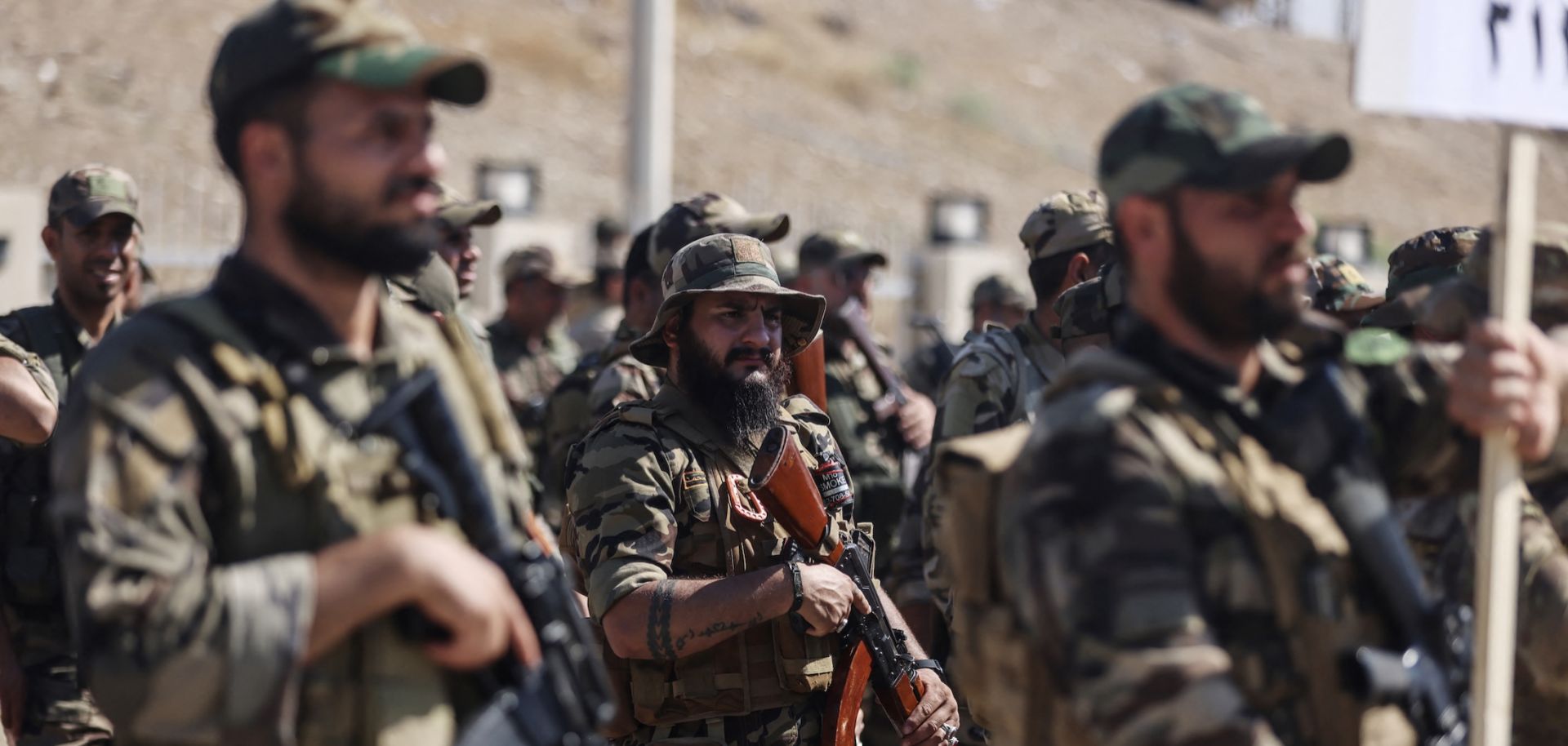Members of Saraya al-Salam gather during a ceremony in the city of Samarra on June 4, 2026, marking their separation from the Sadrist movement and their integration into the Iraqi security forces.