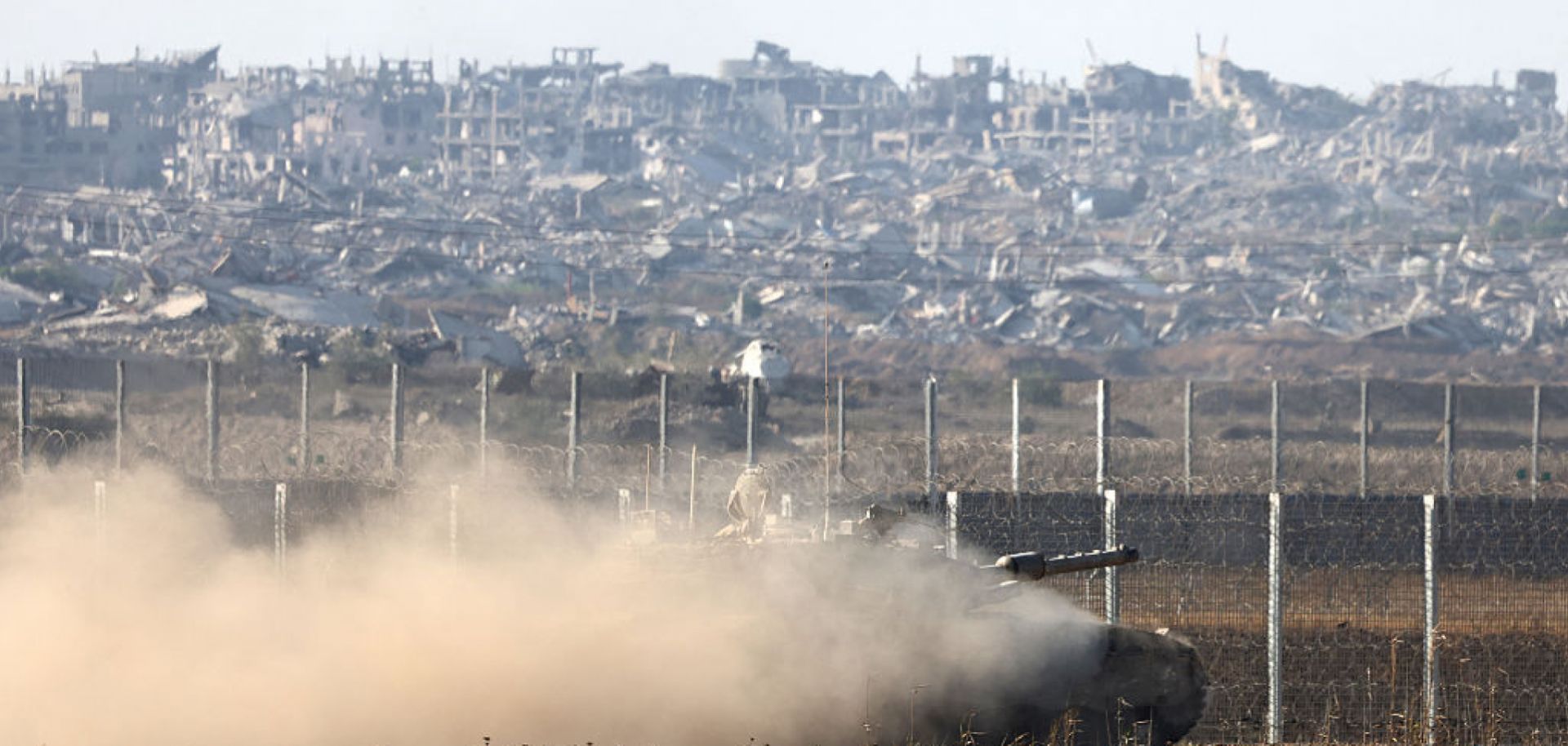 An Israeli tank rolls along the fence on the border with the Gaza Strip on June 4, 2025.