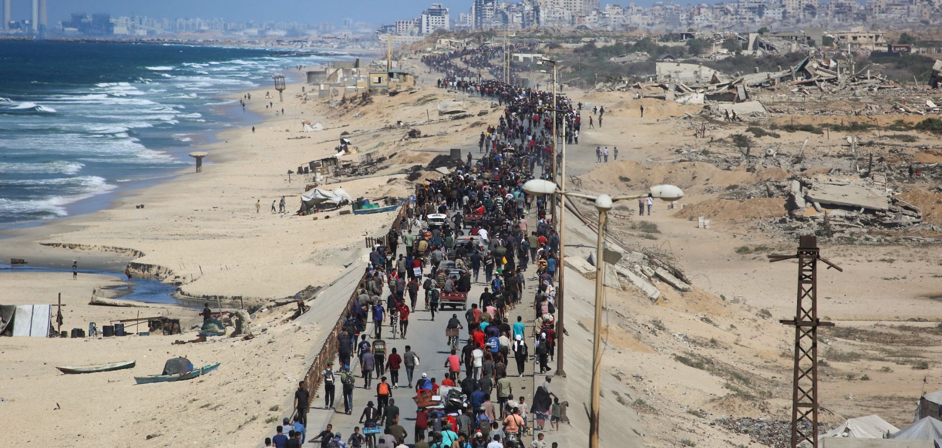 Palestinians on Oct. 10 on Al-Rashid road headed toward Gaza City.
