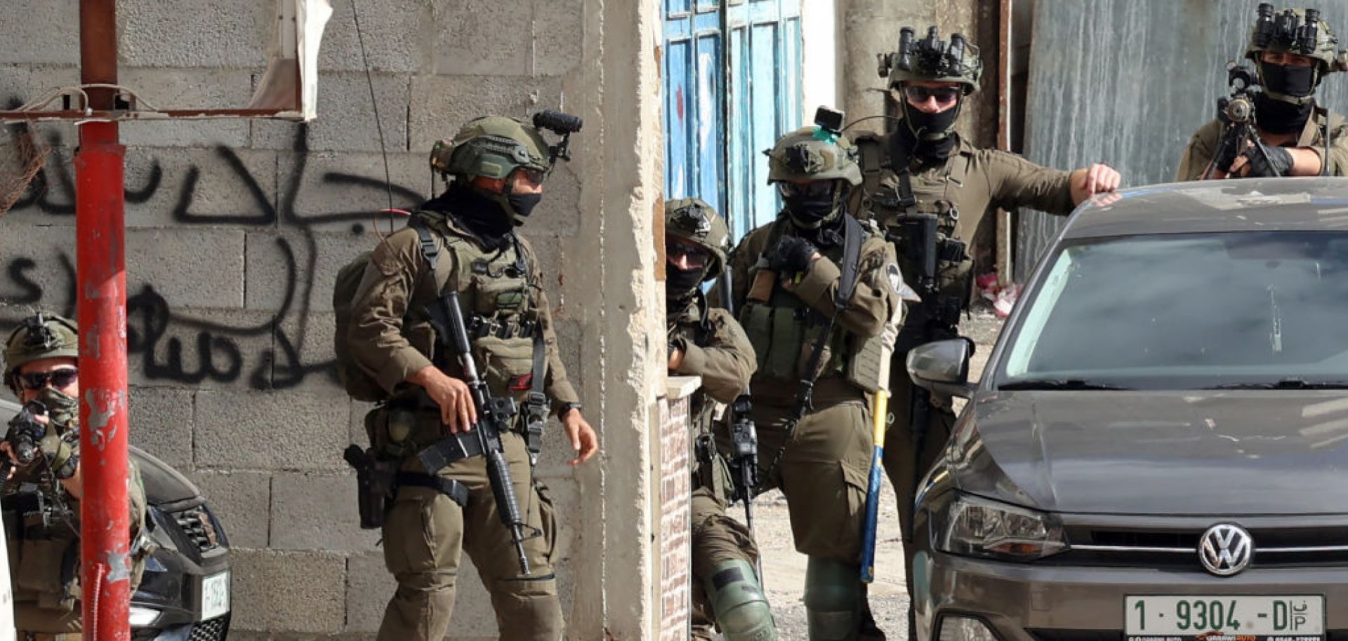 Israeli soldiers conduct a raid in the West Bank on March 19, 2025.