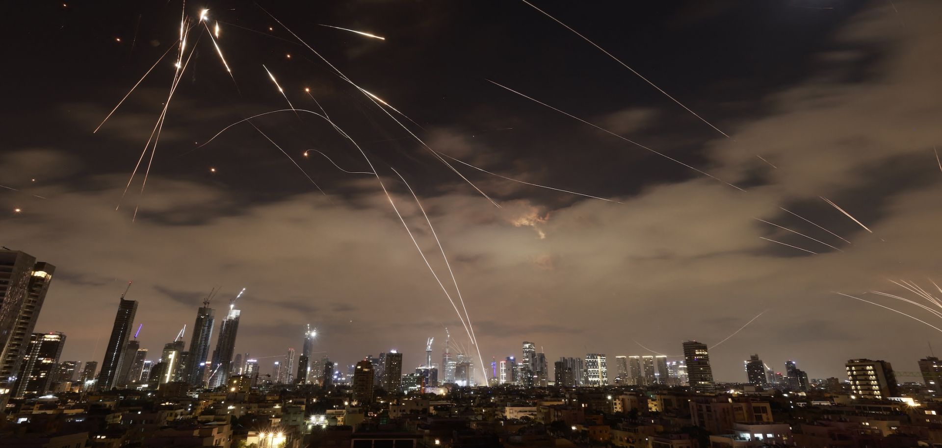 Israeli air defense systems intercept Iranian missiles over Tel Aviv amid a fresh barrage of Iranian rockets on June 16, 2025. Israeli air defense systems intercept Iranian missiles over Tel Aviv amid a fresh barrage of Iranian rockets on June 16, 2025. 