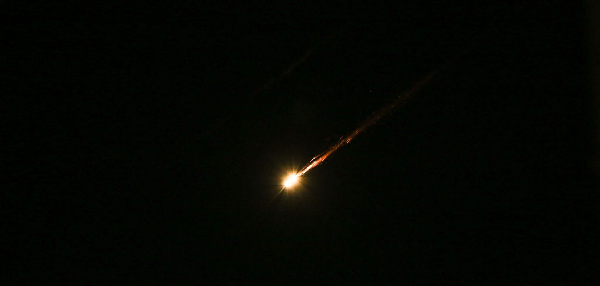 Iranian missiles aimed at targets in Israel pass through the sky over the West Bank on June 17, 2025. 