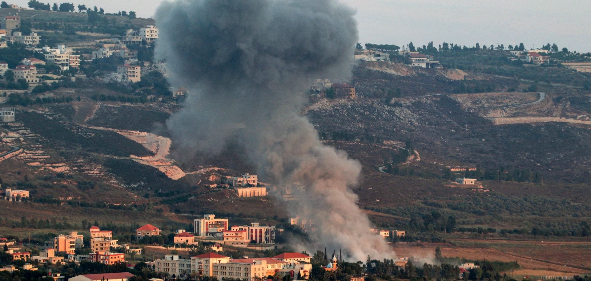 A smoke plume billows during Israeli bombardment on the village of Khiam in southern Lebanon near the border with Israel on June 23, 2024. 