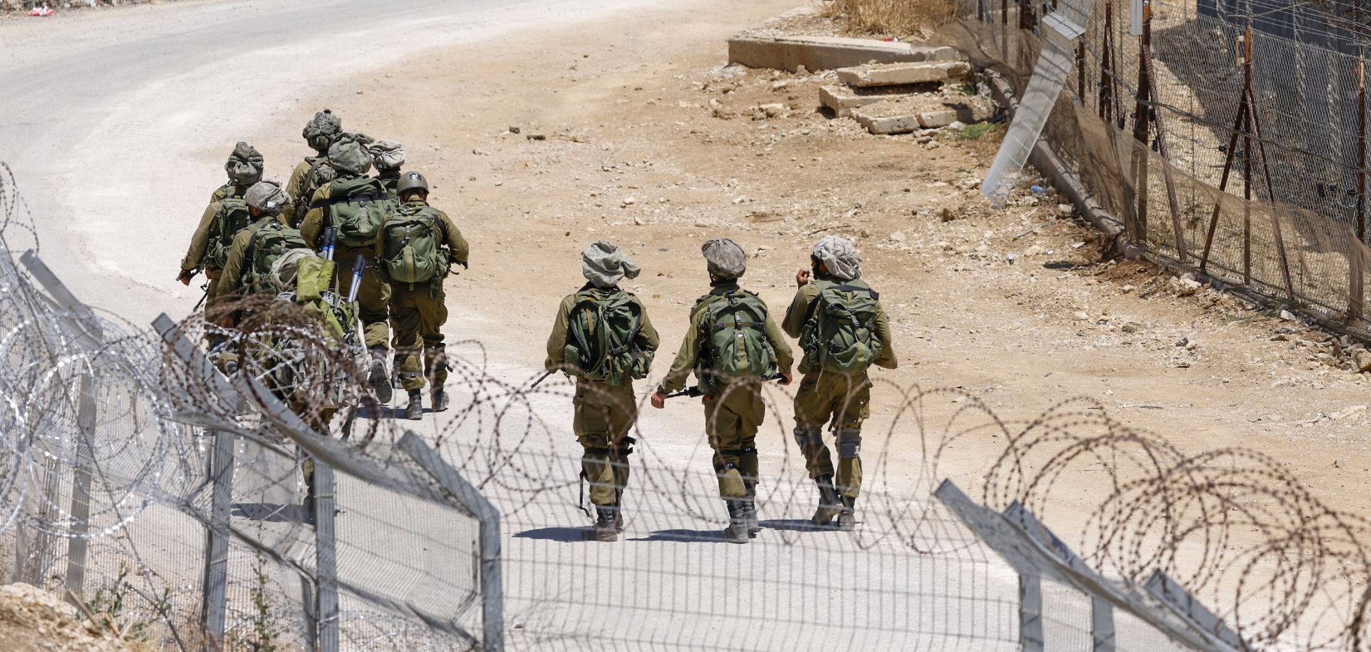 Israeli troops patrol the border fence with Syria near the Druze village of Majdal Shams in the Israel-annexed Golan Heights on July 23, 2025. 
