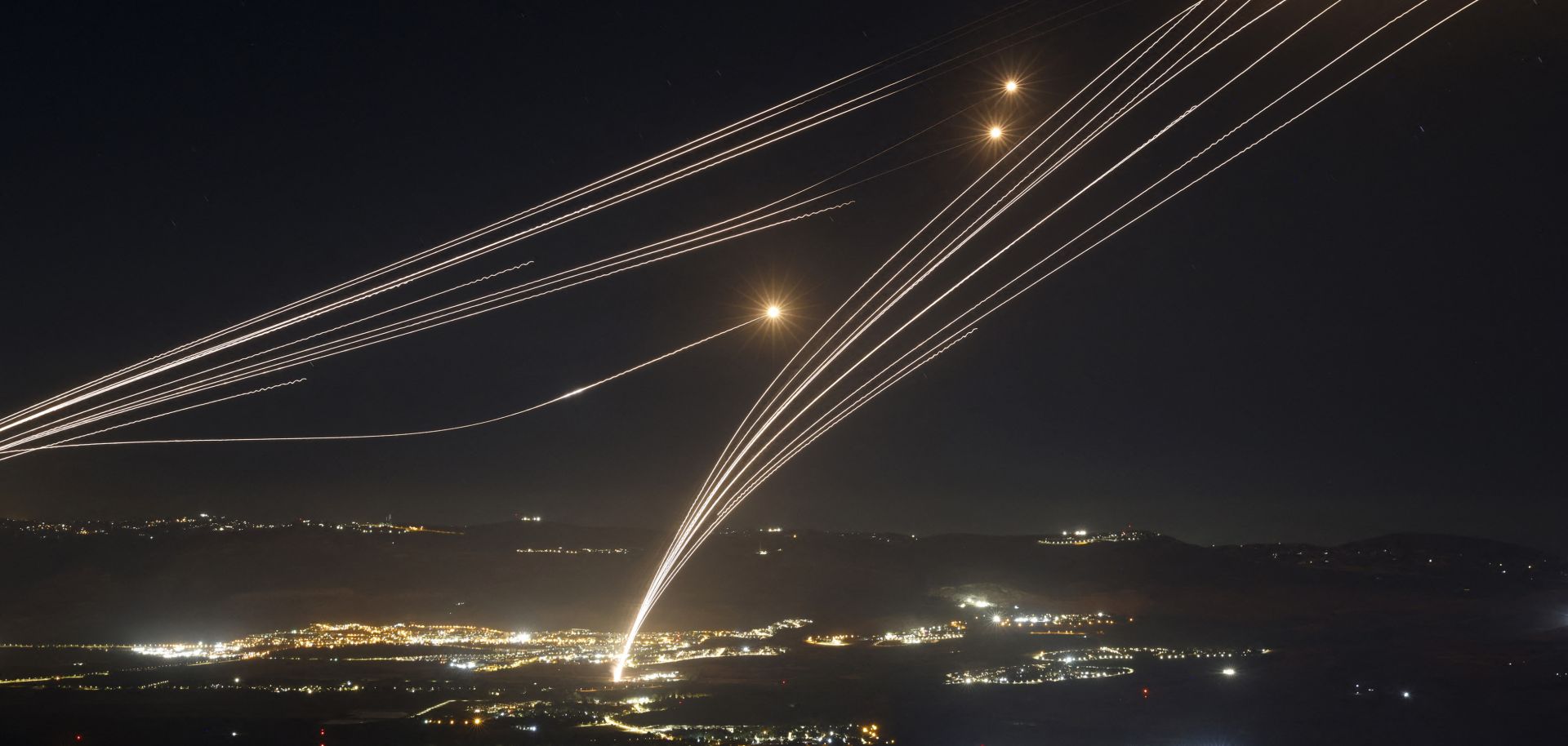 Israel's Iron Dome air defense system intercepts rockets fired from southern Lebanon on Aug. 4, 2024, in the Upper Galilee region of northern Israel.